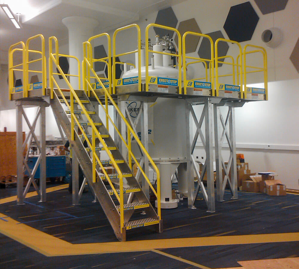 Erectastep industrial stairs and access platform around around tank at Bruke Lab